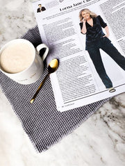 Cup of coffee and newspaper featuring Lorna Jane Clarkson