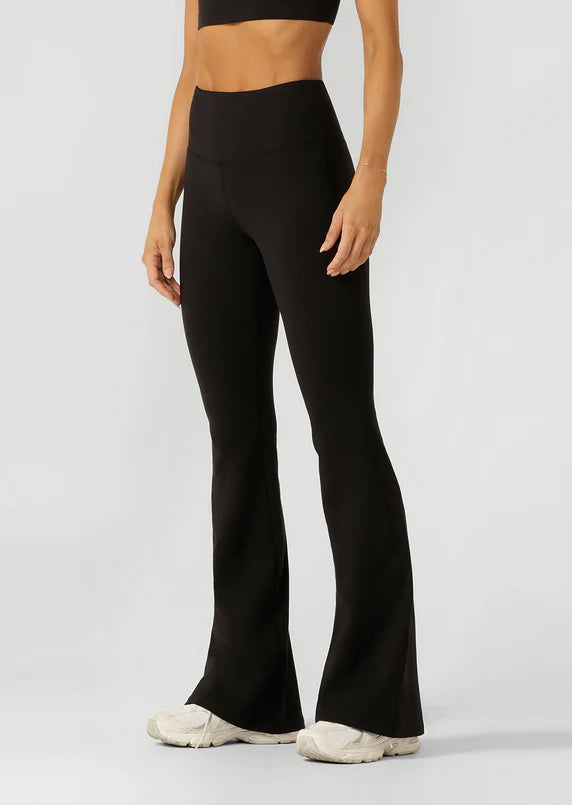 Model wearing Black Lotus Flared leggings