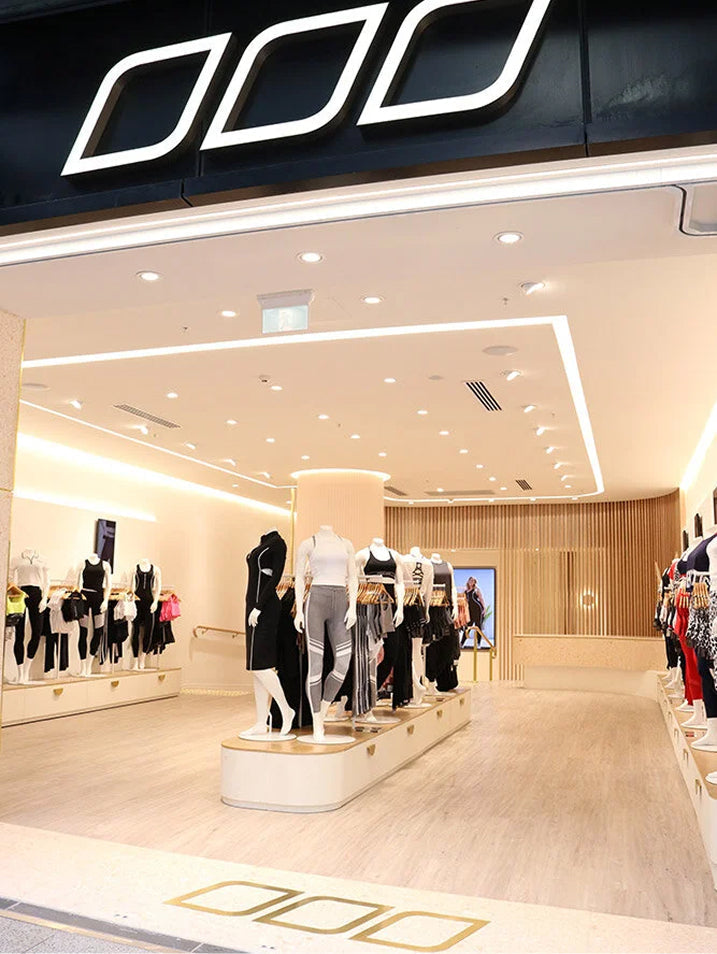 Bright Lorna Jane store interior with activewear displays and mannequins.