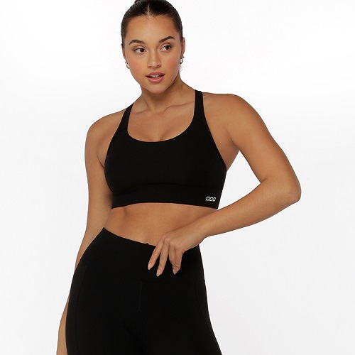 woman wearing sammy biscuit brown high impact sports bra showing clasp back and adjustable straps