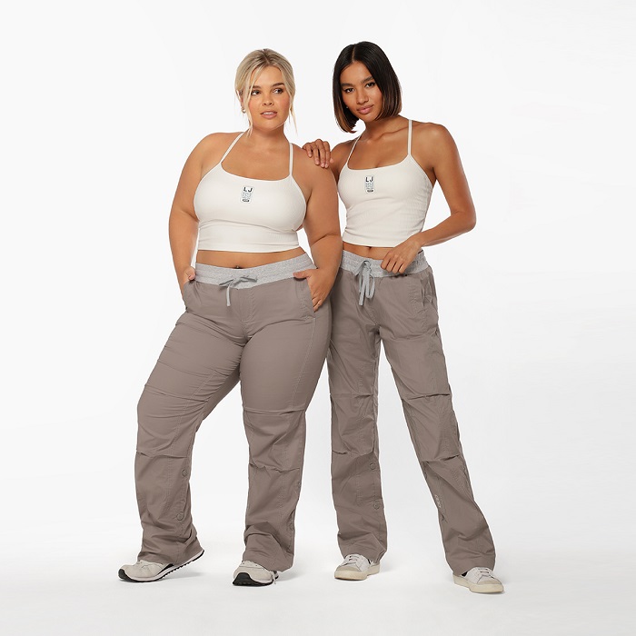 two woman wearing tiktok flash dance pants and white tank top